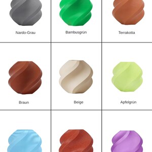 May include: A set of three ceramic mugs with a speckled, matte finish. The mugs are in shades of cream, light brown, and dark brown. Each mug has a simple, minimalist design, perfect for coffee or tea.