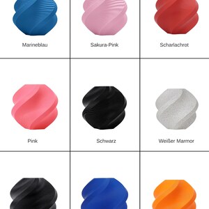 May include: A collection of nine 3D-printed decorative objects in various colors. Colors include blue, pink, red, black, white, and orange. Each object has a unique, spiraling design, and the color names are printed below each object.