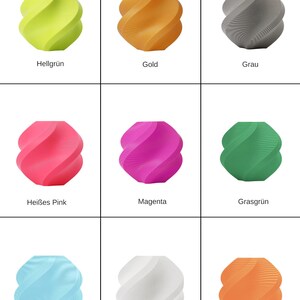 May include: A white ceramic mug with a black handle and the text "But First, Coffee" in a bold, black font. The mug is set against a blurred background, suggesting a cozy setting.