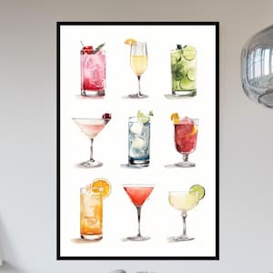 May include: A framed print featuring watercolor illustrations of nine different cocktails. The drinks are in various glasses, garnished with fruit, and in shades of red, pink, yellow, green, and orange. The artwork is set against a white background.