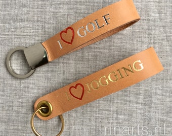 Leather keychain with hand embossed text. I love Golf. I love Jogging