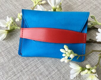 Card holder / pocket wallet in high blue veg tanned leather with red strap. Free personalisation