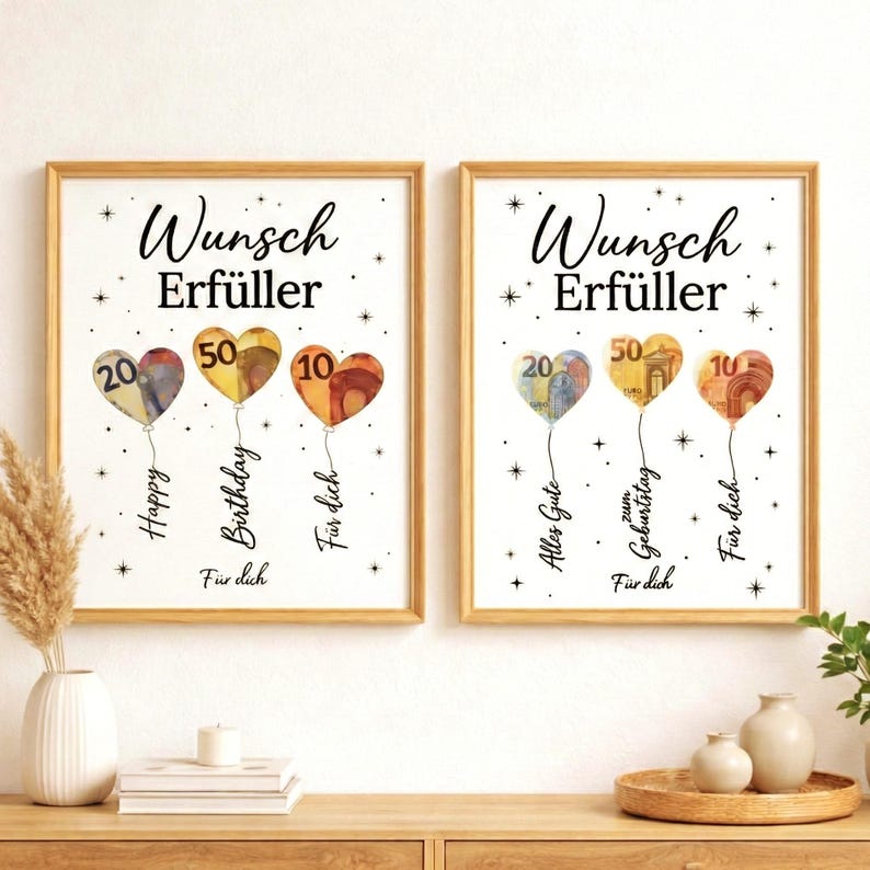 May include: Two framed prints with gold frames. Each print shows heart-shaped balloons made of currency, with numbers 20, 50, and 10. Text includes "Wunsch Erf&uuml;ller", "Happy Birthday", and "F&uuml;r dich".