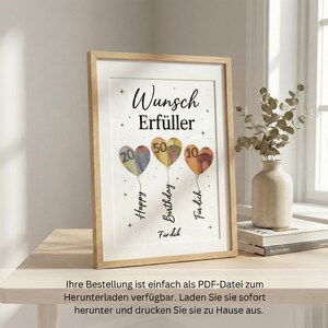 May include: A framed print with a light wood frame. The artwork features three heart-shaped balloons in blue, yellow, and orange, each with a number. Text includes "Wunsch Erf&uuml;ller", "Happy Birthday F&uuml;r dich", and "F&uuml;r dich".