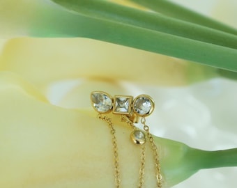 Örhängen med flera stenar och kedjor