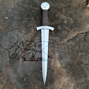 May include: A medieval-style sword with a silver blade and a brown handle. The sword features a circular pommel and a crossguard. The text "The Lord of Metal" is visible on the surface.