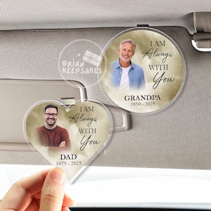 May include: Clear acrylic car charms with photos of a man and the text "I AM Always WITH You." One charm is heart-shaped and says "DAD 1975-2025." The other is round and says "GRANDPA 1950-2025."