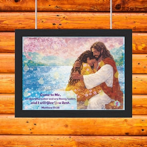 May include: Framed artwork featuring a religious scene with two figures embracing. The artwork has a blue and pink background with text that reads "Come to Me, All You Who Labor and are Heavy Laden, and I will Give You Rest. Matthew 11:28."