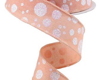 May include: A roll of peach-colored ribbon with white glitter polka dots. The ribbon is 2.5 inches wide and is perfect for adding a touch of sparkle to your crafts and gifts.
