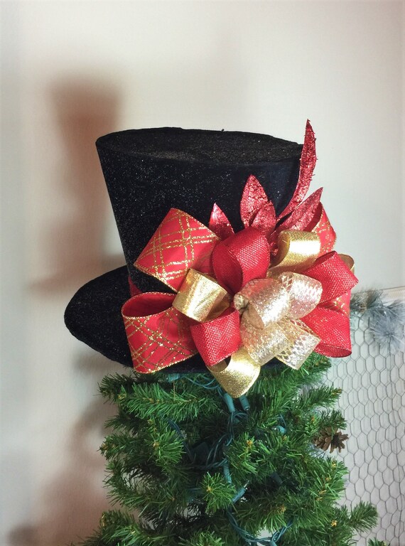 Black Top Hat Christmas Tree Topper with Red and Gold Bow and Red Glittered Bay Leaves