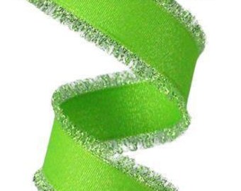 May include: A roll of bright green ribbon with a silver glitter edge. The ribbon has a frayed edge.