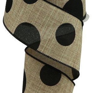 May include: A 2.5 inch wide burlap ribbon with black polka dots. The ribbon is a natural beige color with large black polka dots.