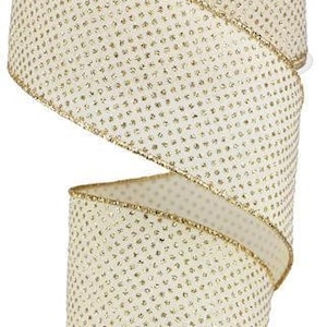 May include: A roll of ivory-colored ribbon with a gold glitter polka dot pattern. The ribbon has a gold wired edge.