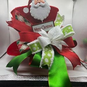 Lg. Christmas Tree Topper Red Velvet Top Hat Centerpiece with a beautiful bow and a metal Merry Christmas Santa sign