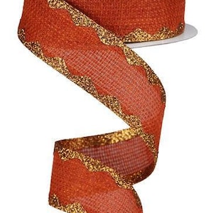 May include: A 2.5 inch wide orange burlap ribbon with a gold glitter zig zag trim.