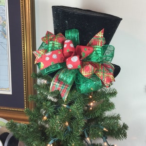 Black Top Hat Christmas Tree Topper handmade emerald green red gold ribbon bow on black velvet hat sprinkled with glitter to look like snow