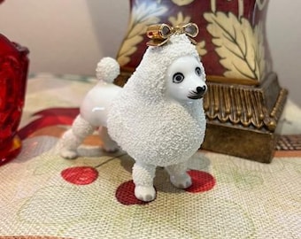 Vintage porcelain poodle with a gold bow on her head, Perfect condition. Made in Japan 50's-60's.