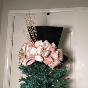 Christmas Tree Topper Top Hat Centerpiece-the stem is now different than shown. Leaves and berries in platinum gold and few changed ribbons