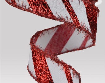May include: A roll of white ribbon with diagonal red glitter stripes. The edges of the ribbon are trimmed with red fringe. The ribbon is unrolled and curled, showing the pattern and texture. This decorative ribbon is suitable for crafts and holiday decorations.