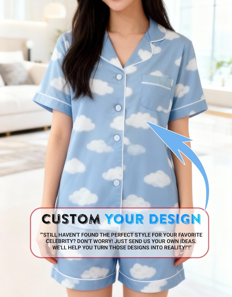 A woman wearing a blue pajama top with a cloud pattern, standing in a room with a couch and a window in the background.