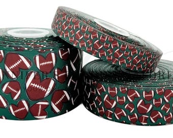 May include: Green and brown ribbon with a repeating pattern of footballs in heart shapes.
