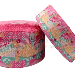 May include: Pink and green patterned ribbon with the text "Boujee Girl Summer" printed on it.