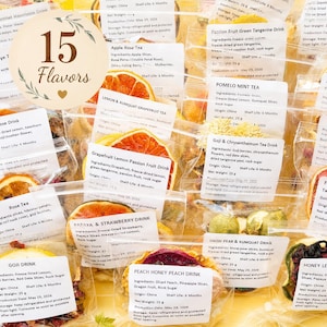 May include: A collection of 15 individual clear plastic pouches containing various dried fruit and tea blends. Each pouch features a white label with printed ingredients, origin, net weight of 25g, and production date of May 29, 2026.