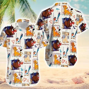 May include: White button-down shirt featuring a repeating pattern of cartoon characters, including a lion, warthog, and other figures. The shirt has short sleeves and a collared neckline. The design includes geometric shapes and stylized elements.