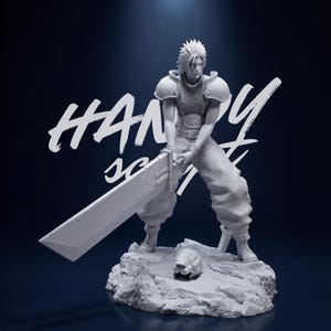 May include: A gray figurine of a character from Final Fantasy, holding a large sword. The figure is standing on a rocky base, with a helmet nearby. The text "HANDY" is visible in white on the background.