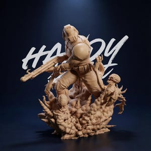 May include: A tan-colored figurine of a futuristic soldier in combat gear, holding a rifle and standing on a textured base. The figurine is battling a monster. The word "HARDY" is written in white script across the top.