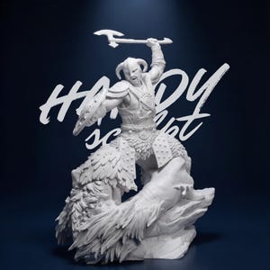 May include: A white figurine of a warrior in horned helmet, raising an axe. The warrior is atop a creature, with a shield on the left arm. The background is dark blue with white text that reads "Hardy is not".