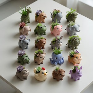 May include: A selection of animal-shaped planters, each with a succulent plant. The planters are designed as a giraffe, dog, cat, bunny, frog, pig, elephant, koala, bear, donkey, lion, turtle, deer, octopus, hamster, sloth, chicken, hedgehog, and unicorn.