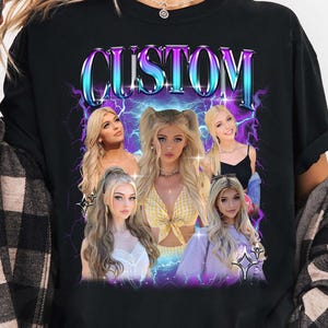 May include: Black long-sleeve shirt featuring a graphic design with the word "CUSTOM" in a stylized font, with images of a person. The design includes purple and blue lightning bolt accents.