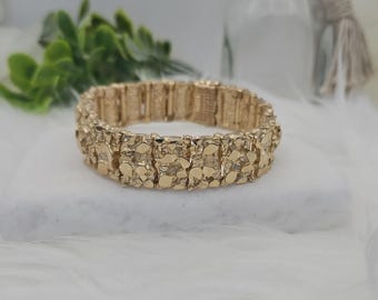 Pulseira Gold Nugget: Ouro maciço 14k, disponível em 13 mm ou 15 mm.
