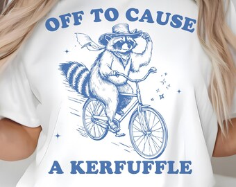 Off to Cause a Kerfuffle PNG SVG, Cowboy Raccoon Riding Bicycle, Funny Mischief Quote Design, Silly Animal Mental Health Tee Adult Humor Png
