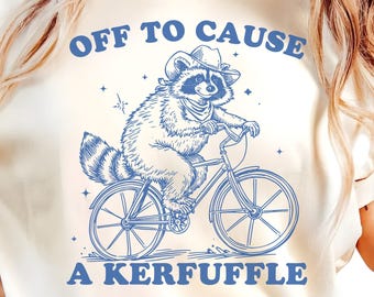 Off to Cause a Kerfuffle PNG SVG, Cowboy Raccoon Riding Bicycle, Funny Mischief Quote Design, Silly Animal Mental Health Tee Adult Humor Png
