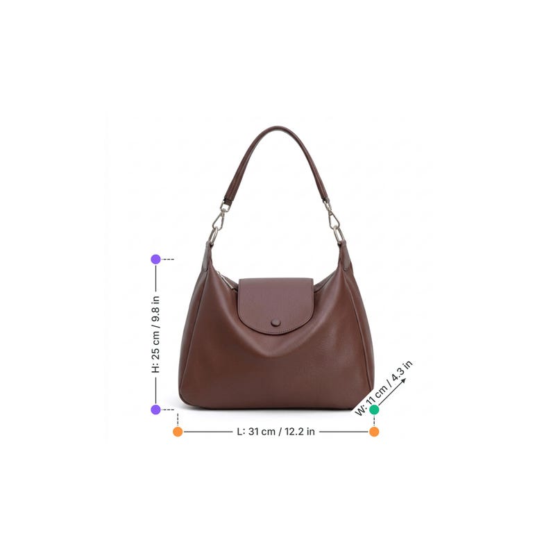 May include: A brown leather shoulder bag with a flap closure and a single handle. The bag is 31 cm long, 25 cm high, and 11 cm wide. The handle is attached to the bag with silver-colored chain links.