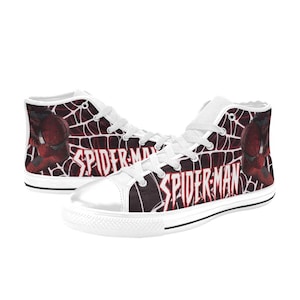 May include: Pair of high-top canvas sneakers featuring a Spider-Man design. The shoes have a white toe cap, laces, and tongue. The sides display a red and black web pattern with the words "SPIDER-MAN" and an image of Spider-Man.