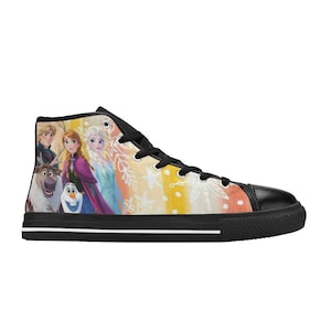 May include: High-top canvas sneaker featuring characters from the animated film Frozen. The shoe has a black toe cap, laces, and sole. The side panel displays a colorful illustration of Elsa, Anna, Olaf, Kristoff, and Sven against a yellow, orange, and white background.