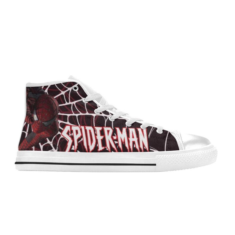 May include: High-top canvas sneakers featuring a Spider-Man design. The shoes have a white rubber toe cap and sole with a black stripe. The Spider-Man logo and character are printed on the side in red and white.