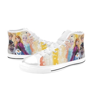 May include: White high-top sneakers featuring a colorful design with characters from the animated movie Frozen. The shoes have a white rubber sole, white laces, and a vibrant pattern of the characters on the sides.