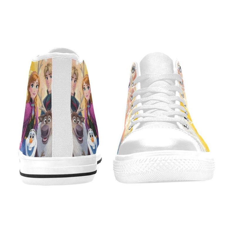 May include: White high-top sneakers featuring a colorful graphic of characters from the animated movie Frozen. The design includes Anna, Elsa, Kristoff, Sven, and Olaf. The shoes have white laces and a white rubber sole.