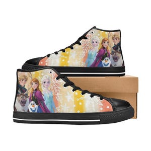 May include: High-top canvas sneakers featuring a colorful design with characters from the animated movie. The shoes have black soles, laces, and toe caps. The background has a yellow, orange, and white gradient with snowflake accents.