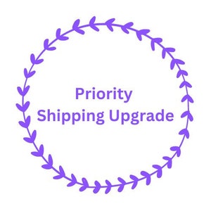 May include: Purple wreath with the text "Priority Shipping Upgrade" inside.