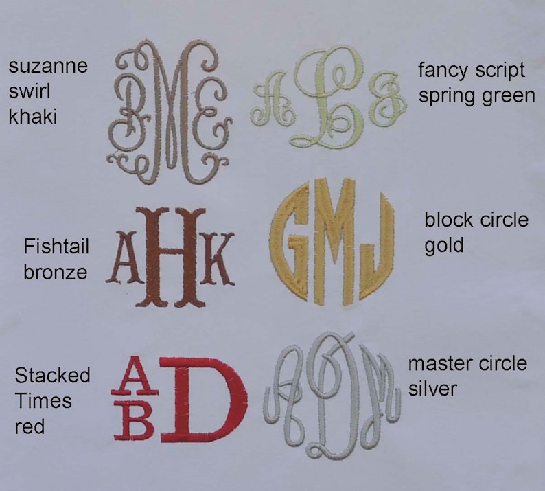 May include: A variety of monogram styles and fonts are shown in different colors, including khaki, bronze, gold, silver, and red. The monograms are embroidered on a white fabric background. The text "suzanne swirl khaki", "fishtail bronze", "block circle gold", "master circle silver", "stacked times red", and "fancy script spring green" are also shown.