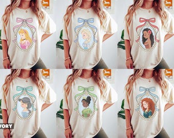 Camiseta vintage de princesas Disney con lazo coqueto, Bella, Ariel, Elsa y Cenicienta, camiseta del Castillo Mágico del Reino Mágico, regalo de viaje para niñas de Walt Disney