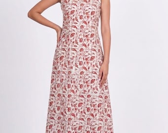 Vestido midi de algodón con estampado floral, sin mangas, ideal para el verano y ocasiones informales.