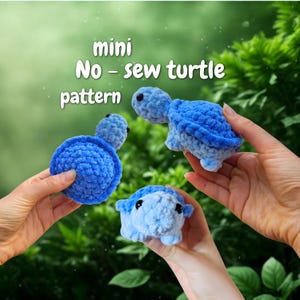 May include: Three handmade, mini, blue crochet turtles. The turtles are in varying shades of blue, with a textured, plush appearance. The image includes the text "mini No-sew turtle pattern".