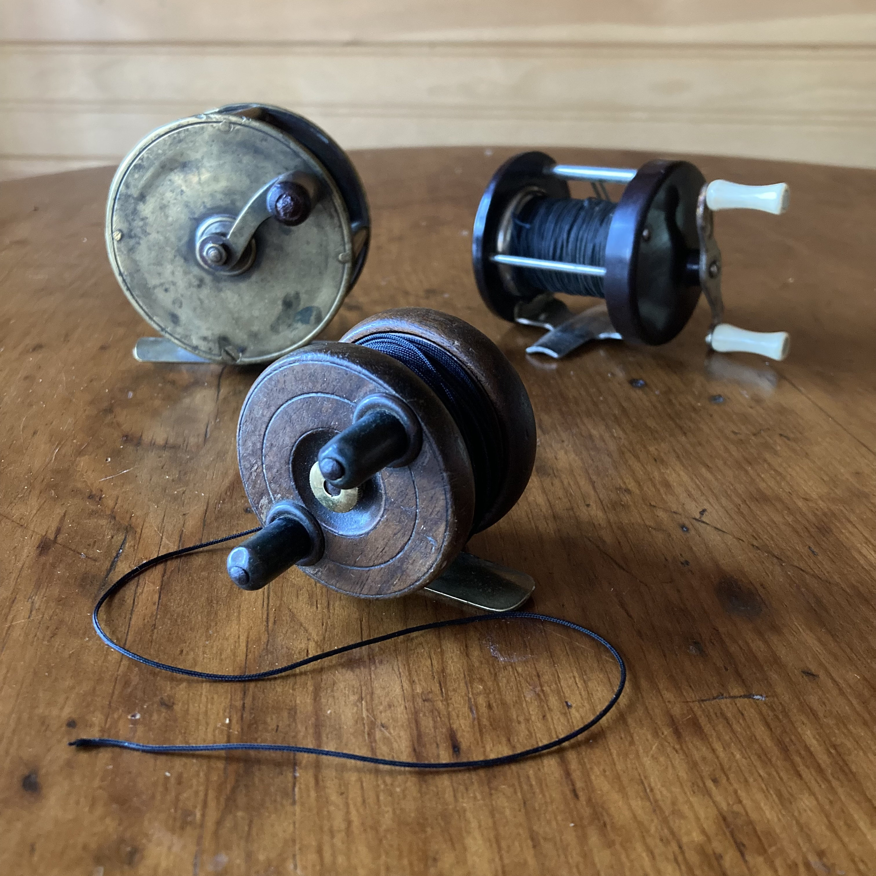 Vintage Fishing Reels THREE Solid Brass, Wood Brass, and Bakelite