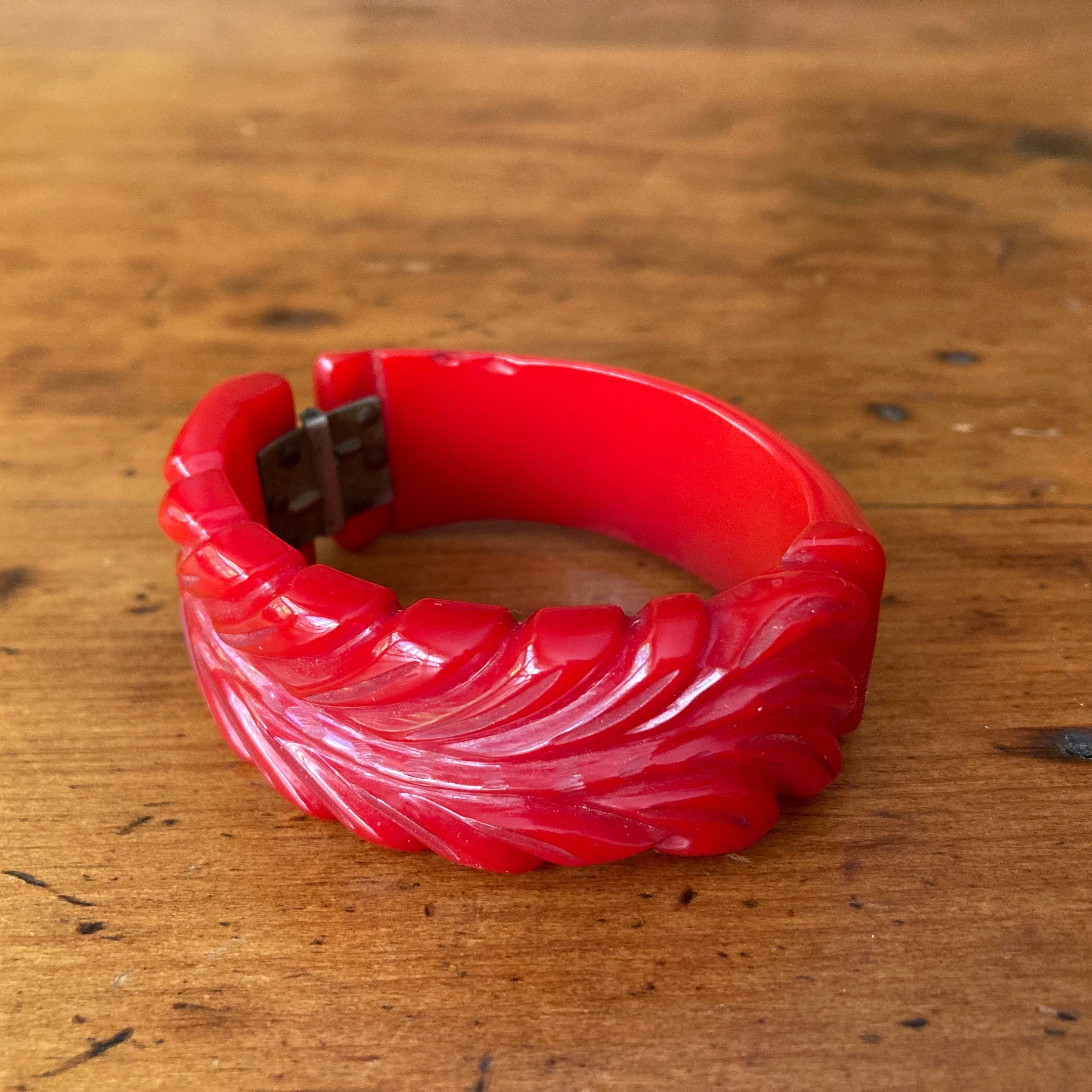 Sold at Auction: Two Bakelite carved multi-color bangle bracelets, 1 1/8